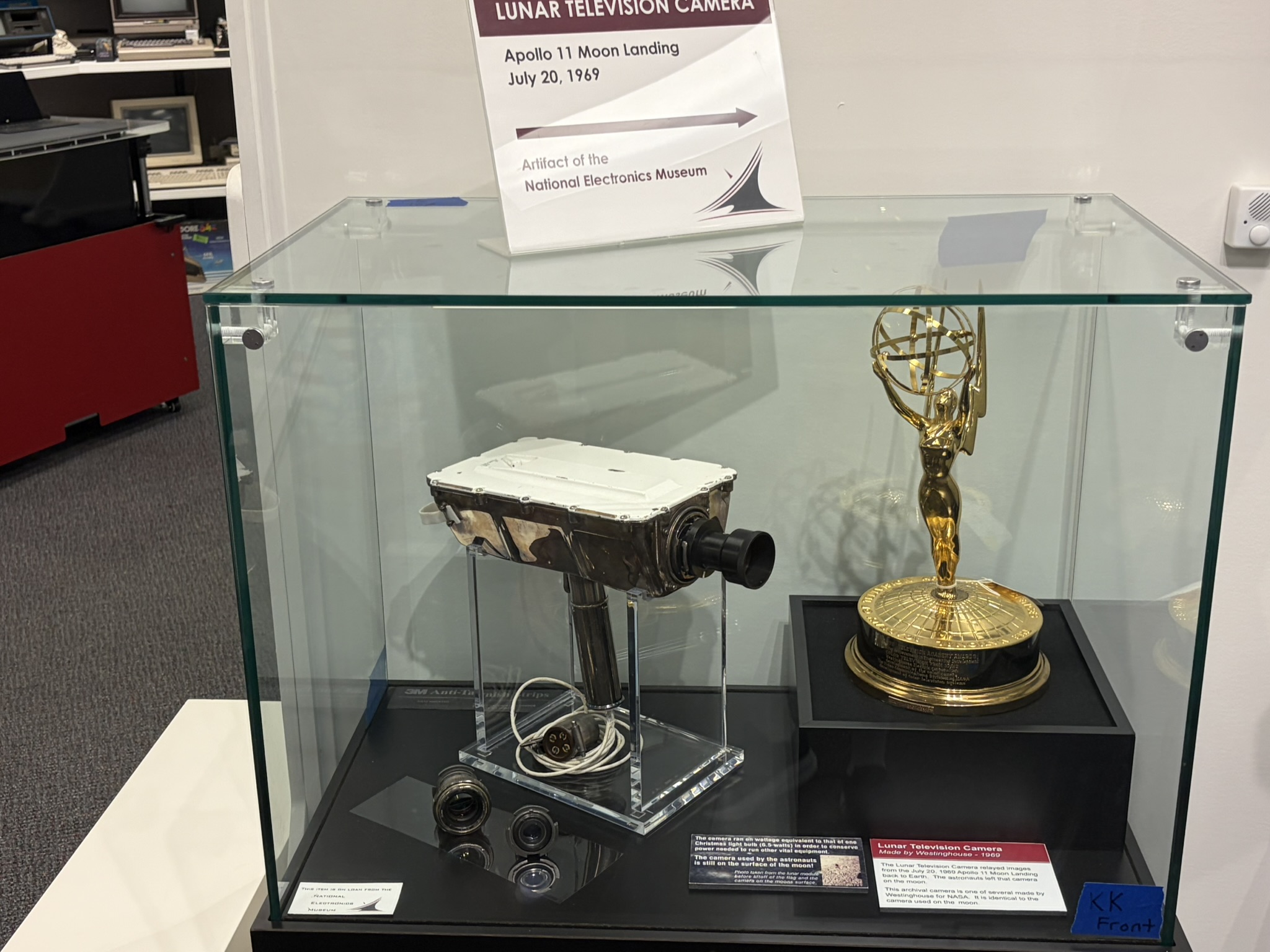 a museum exhibit of an old camera and an Emmy statue